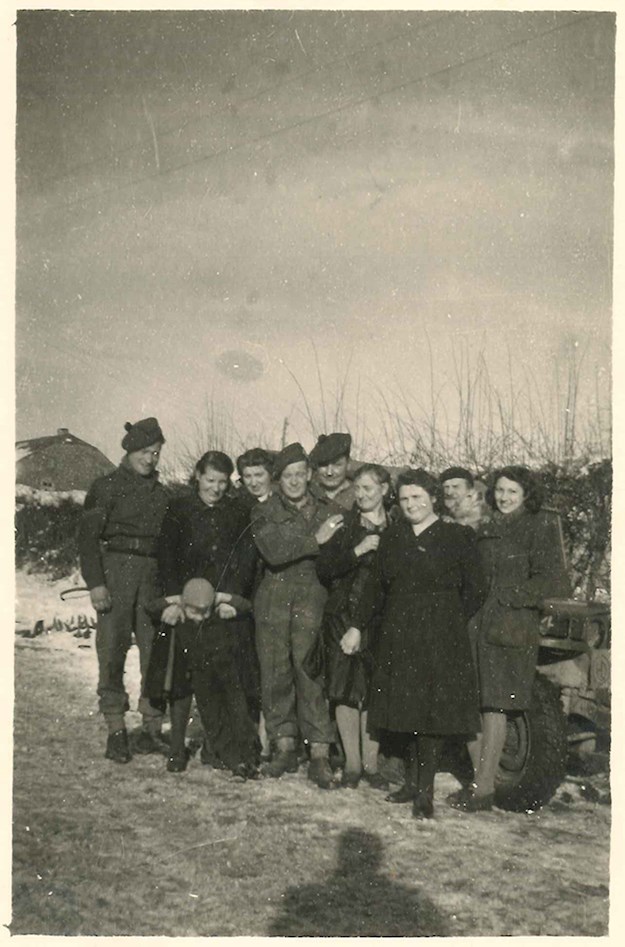 Civilians together with the Scottish liberators in Mierchamps, near La Roche-en-Ardenne, January 1945.