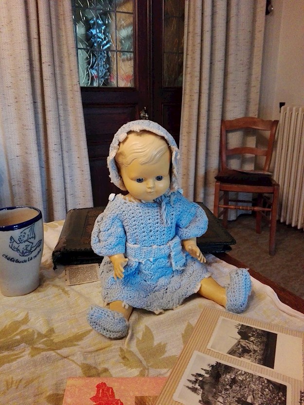 Even at old age, Andrée cherished the doll she rescued from her ruined town. © Andrée Collin