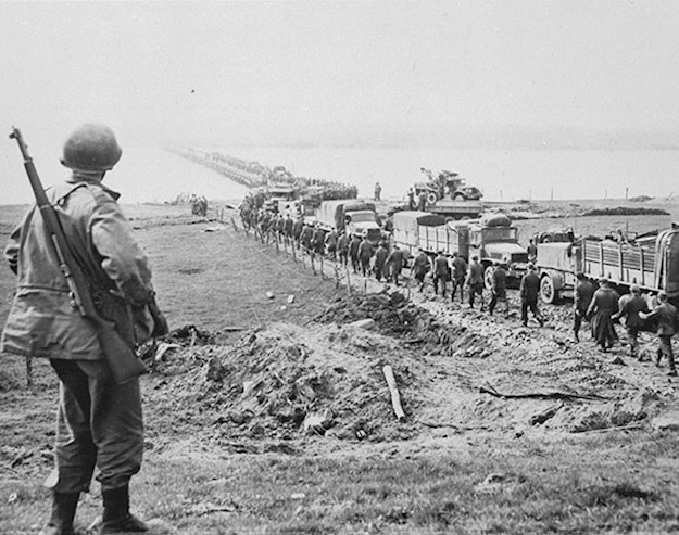 German prisoners of war cross the Rhine while supplies travel in the opposite direction.