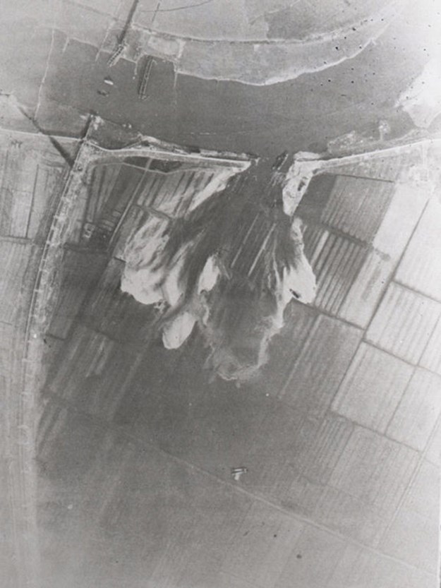 Aerial photograph of the blown up dike at Arnhem that led to the flooding of the Betuwe.