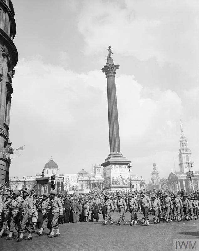 AMERICANS IN BRITAIN, 1942 - 1945 (EA 18861) Black GIs in Britain: Black United States troops take part in a huge parade of US troops and material during the 'Salute the Soldier' campaign, 30 March 1944. The troops are seen marching past Nelson's Column in Trafalgar Square, London. Copyright: © IWM. Original Source: http://www.iwm.org.uk/collections/item/object/205193572