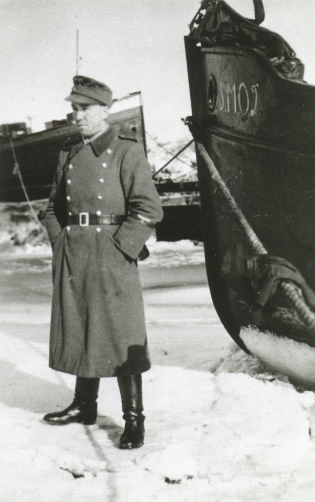 A German soldier standing guard near the ferries in the harsh winter. Schlei Bunker Museum Archive