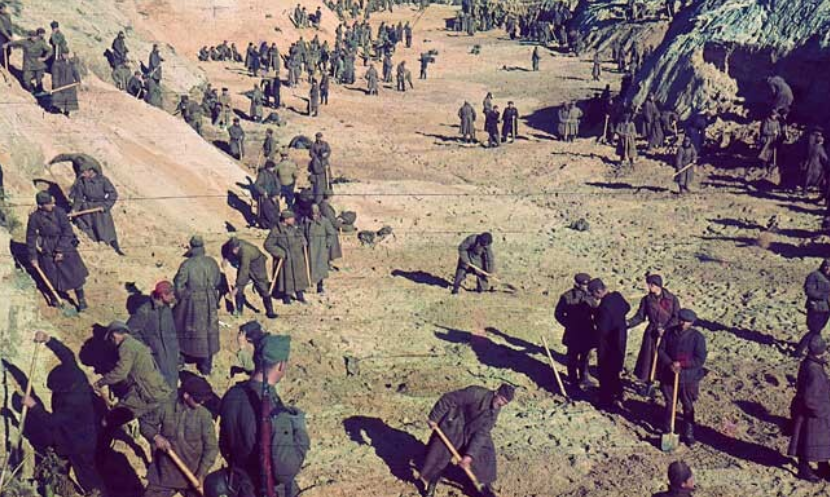 1941, Ukraine, Kyiv. Soviet prisoners of war under the protection of German soldiers bury the bodies of Jews shot on September 29-30, 1941 in Babyn Yar. Probably October 11